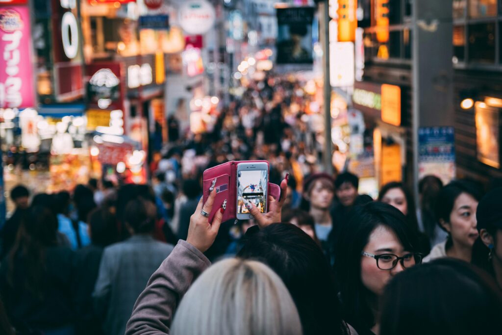 Woman taking a picture and looking for new things to try.