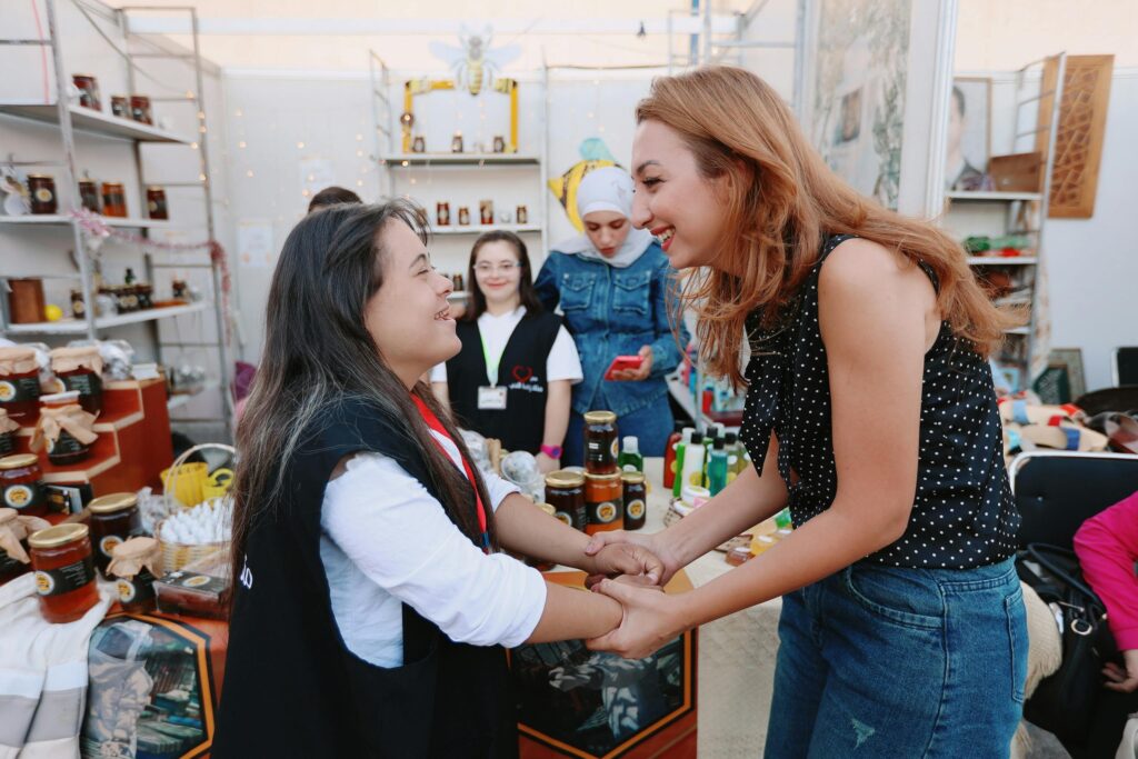 Women combating feelings of being alone by helping other women at a food bank.