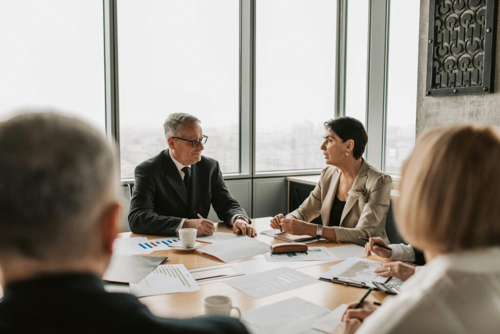 Frustrated high-performing team at a table in discussion